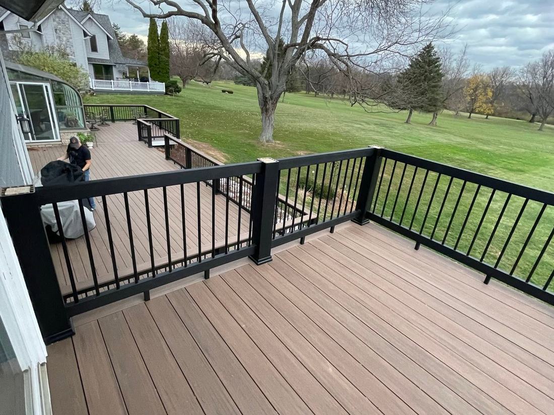 View from the second-floor deck off the master bedroom looking down at the main-floor deck