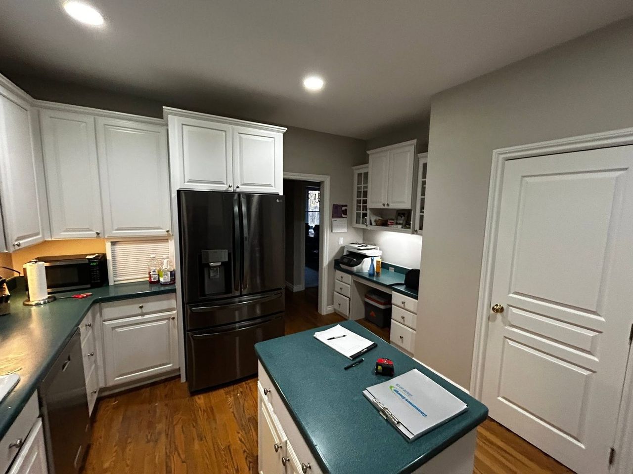 Kitchen before remodeling, looking toward the refrigerator and doorway