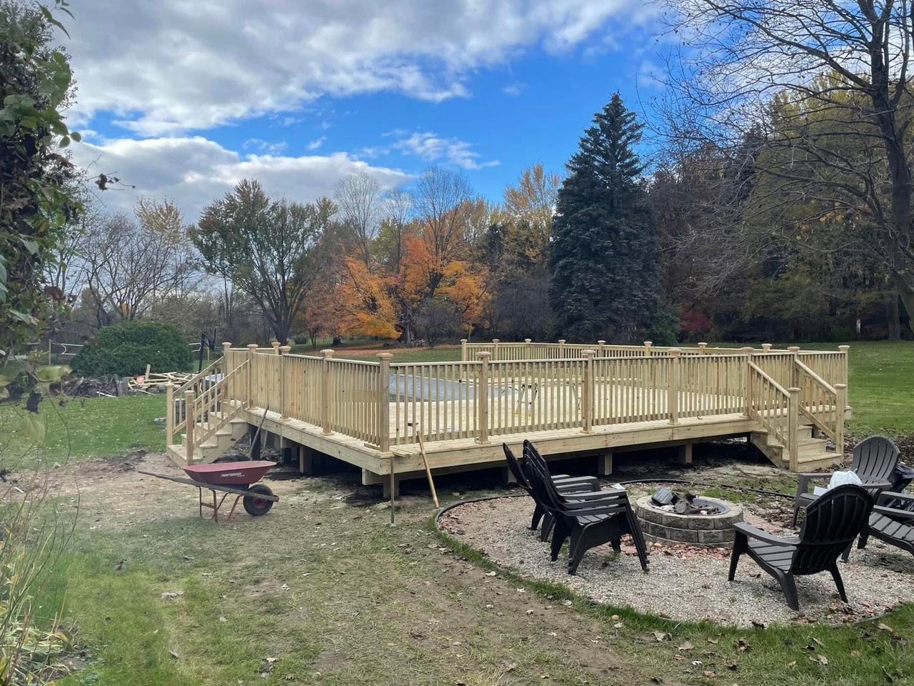 Finished pool deck with railing and stairs on both ends